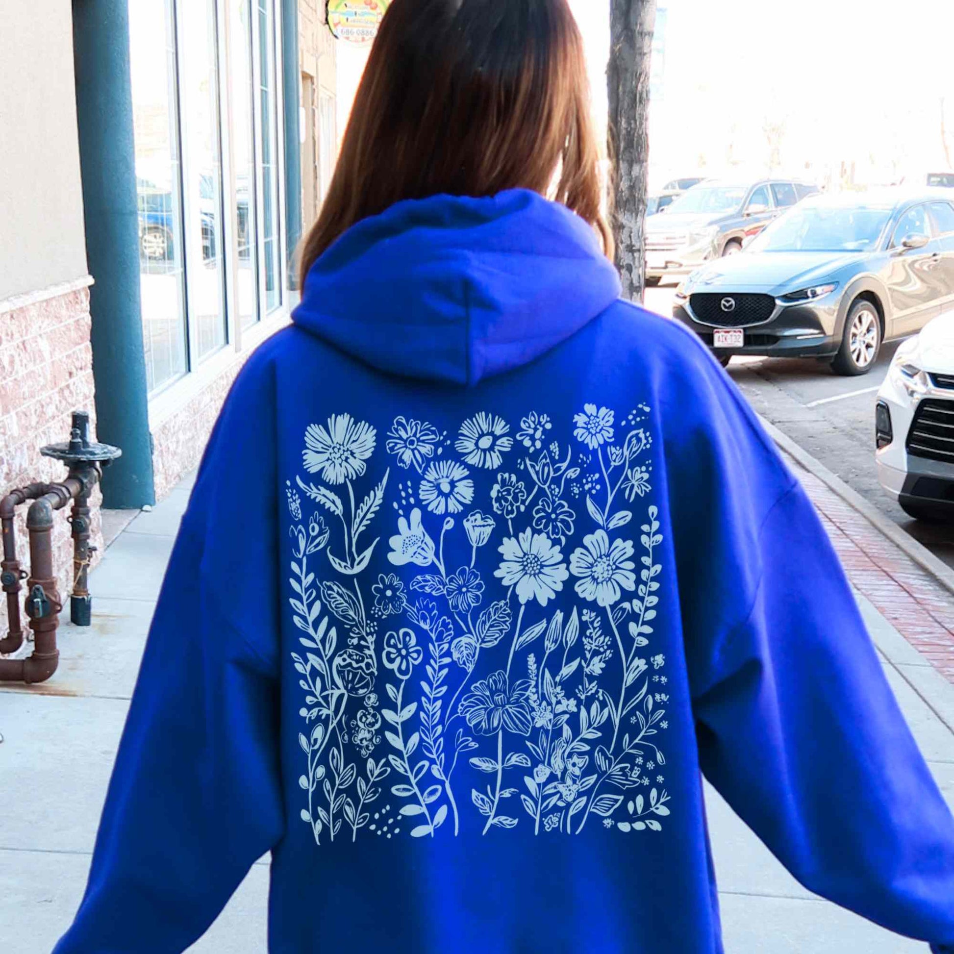 Royal Blue Hoodie with light blue wildflower design on the back, granola girl aesthetic