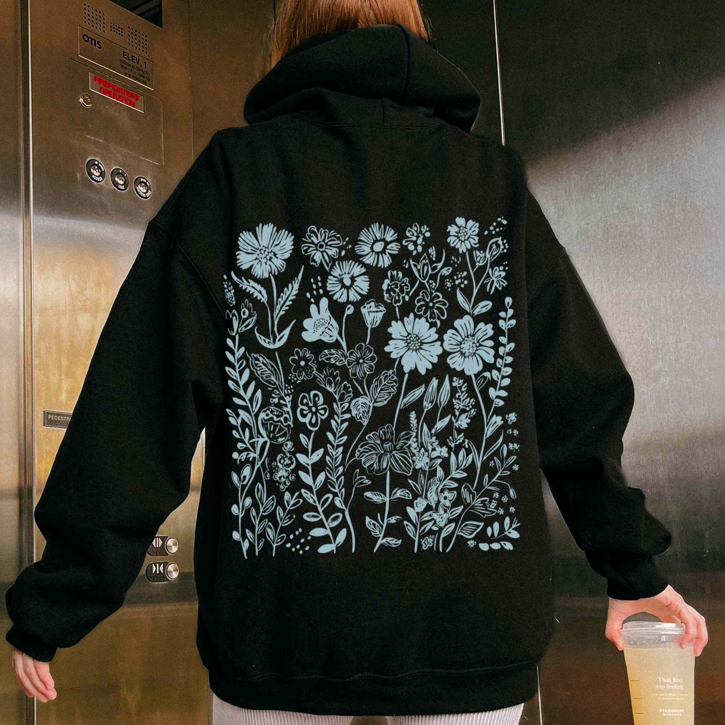 Black Hoodie with light blue wildflower design on the back, granola girl aesthetic