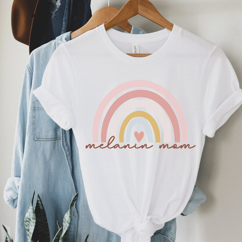 white unisex melanin mom shirt with a rainbow that says melanin mom underneath