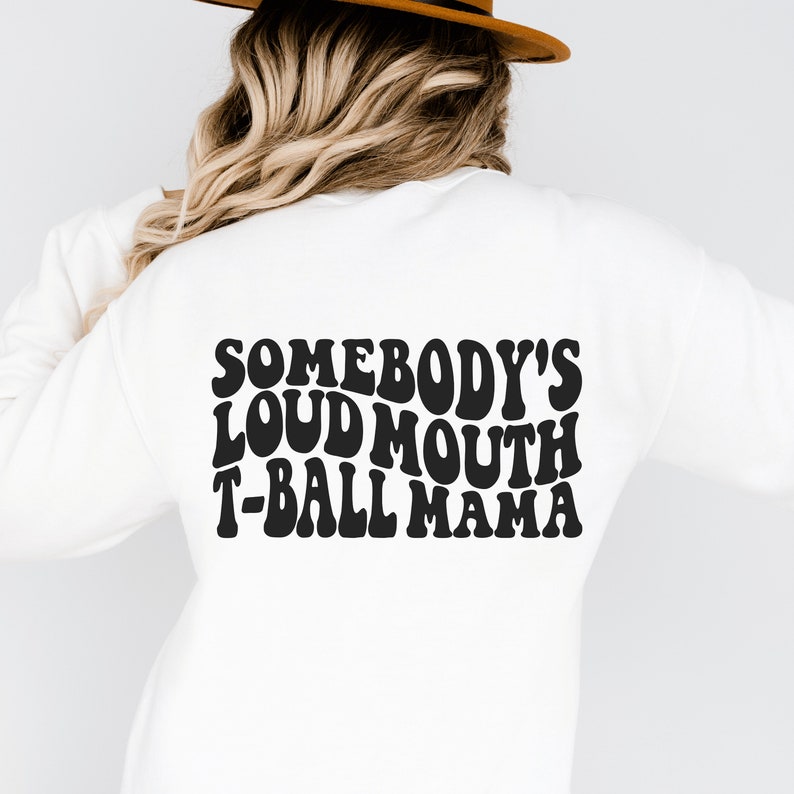 white  unisex tball mom shirt that says somebody's loudmouth t-ball mama