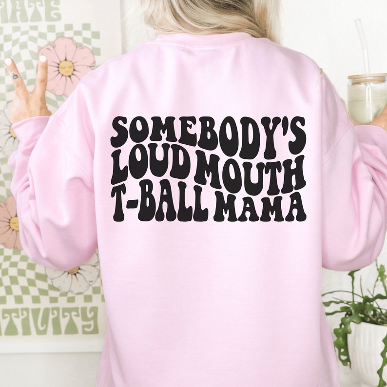 pink  unisex tball mom shirt that says somebody's loudmouth t-ball mama