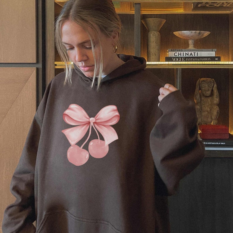 brown bow hoodie with cherry ribbon design on front of hoodie