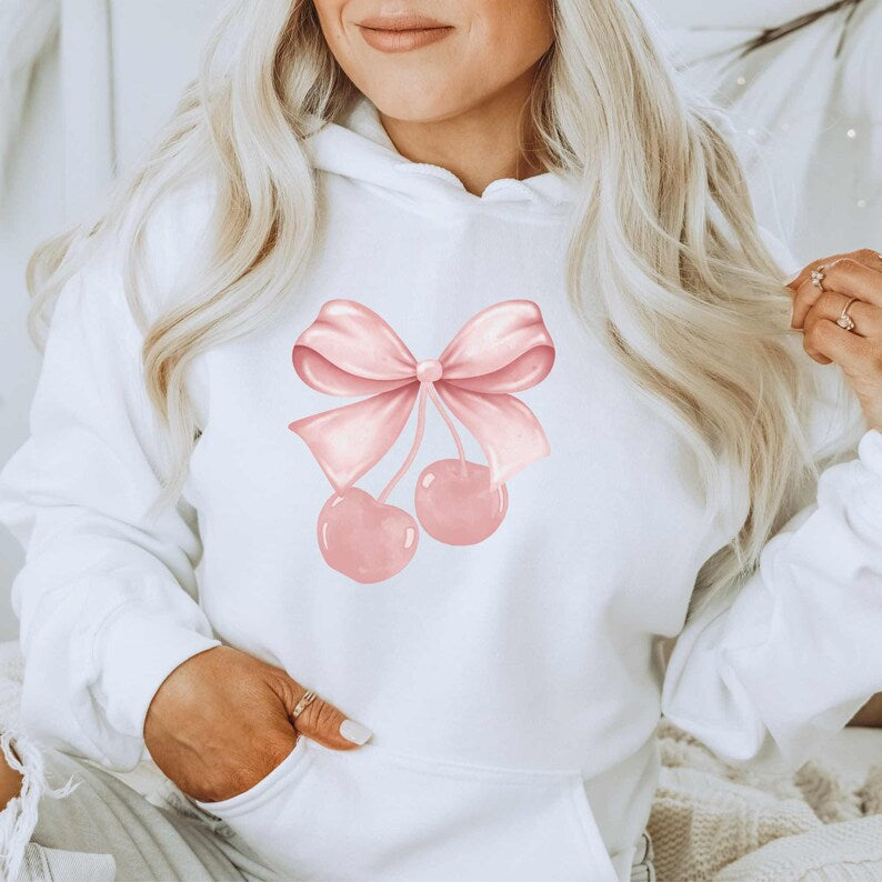 white bow hoodie with cherry ribbon design on front of hoodie