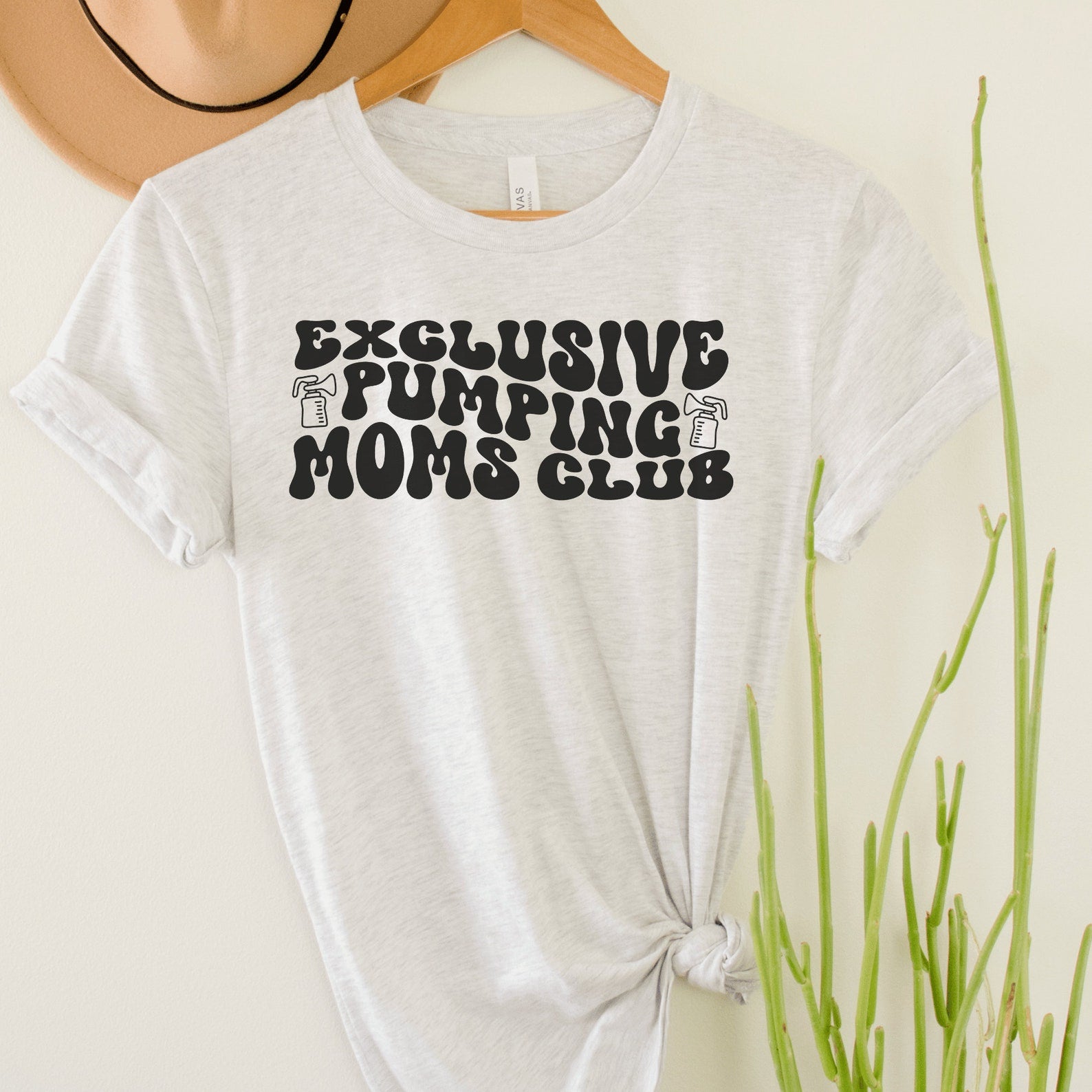 light gray unisex funny breastfeeding shirts that says exclusive pumping moms club in retro styled black letters