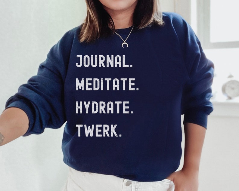 navy blue unisex sweatshirt with the phrases Journal, Meditate, Hydrate, Twerk in all capital white letters.