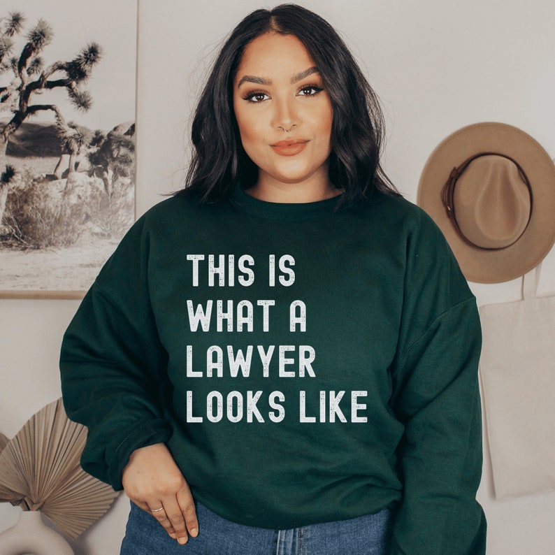 forest green unisex lawyer sweatshirt that says this is what a lawyer looks like