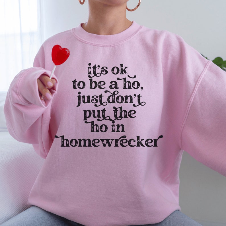 pink unisex cheater shirt sweatshirt that says its ok to be a ho, just don't put the ho in homewrecker