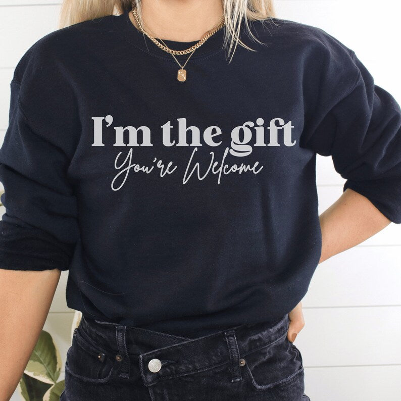 black unisex sassy sweatshirt that says i'm the gift you're welcome in white lettering