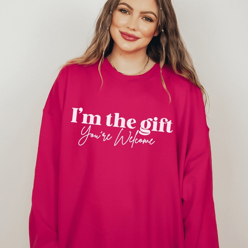 hot pink unisex sassy sweatshirt that says i'm the gift you're welcome in white lettering