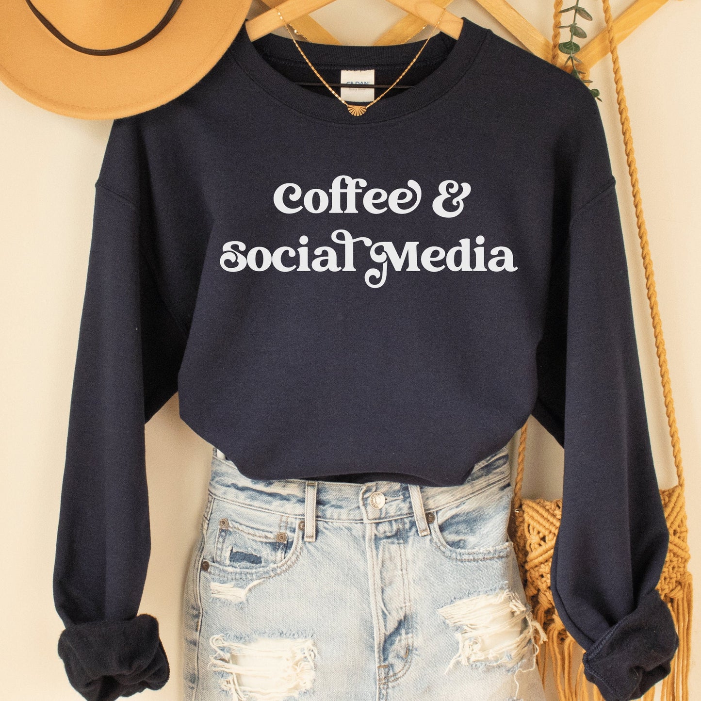 navy blue unisex sweatshirt that says coffee and social media, great gifts for social media managers