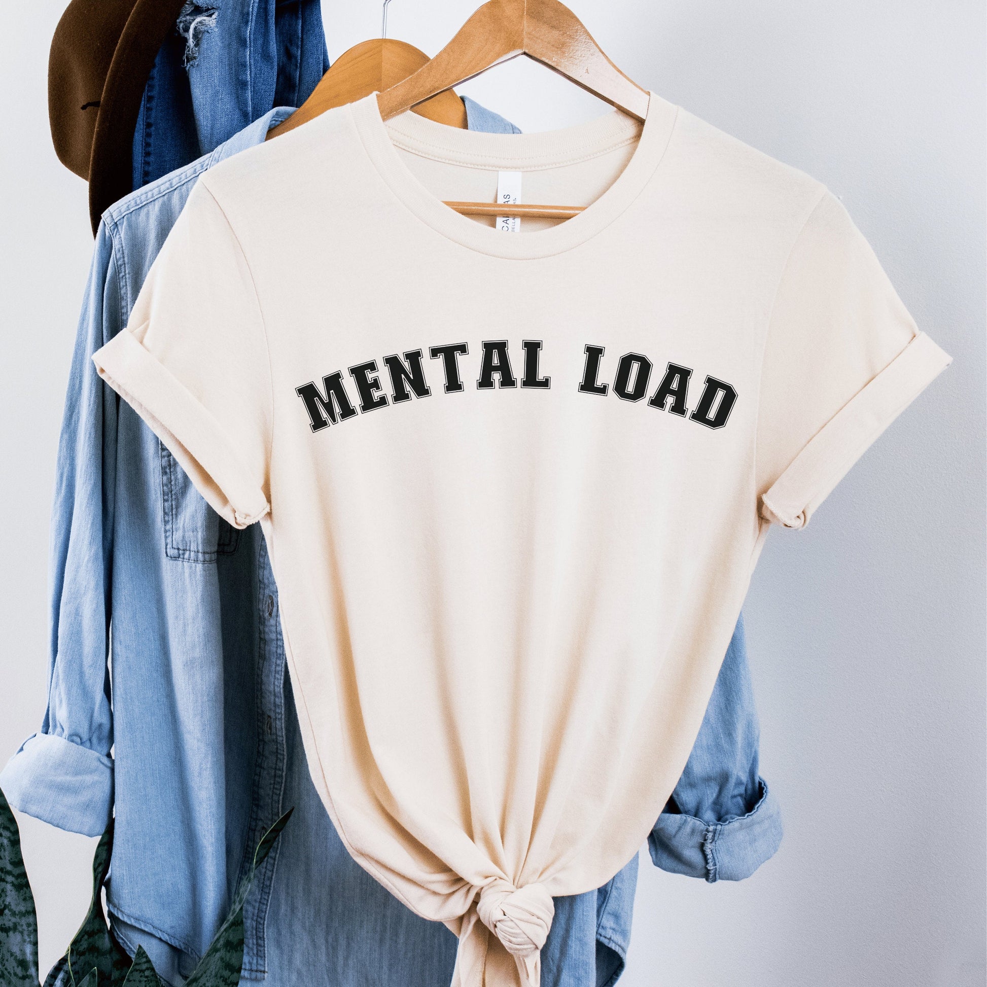 soft cream unisex overstimulated mom shirt that says mental load