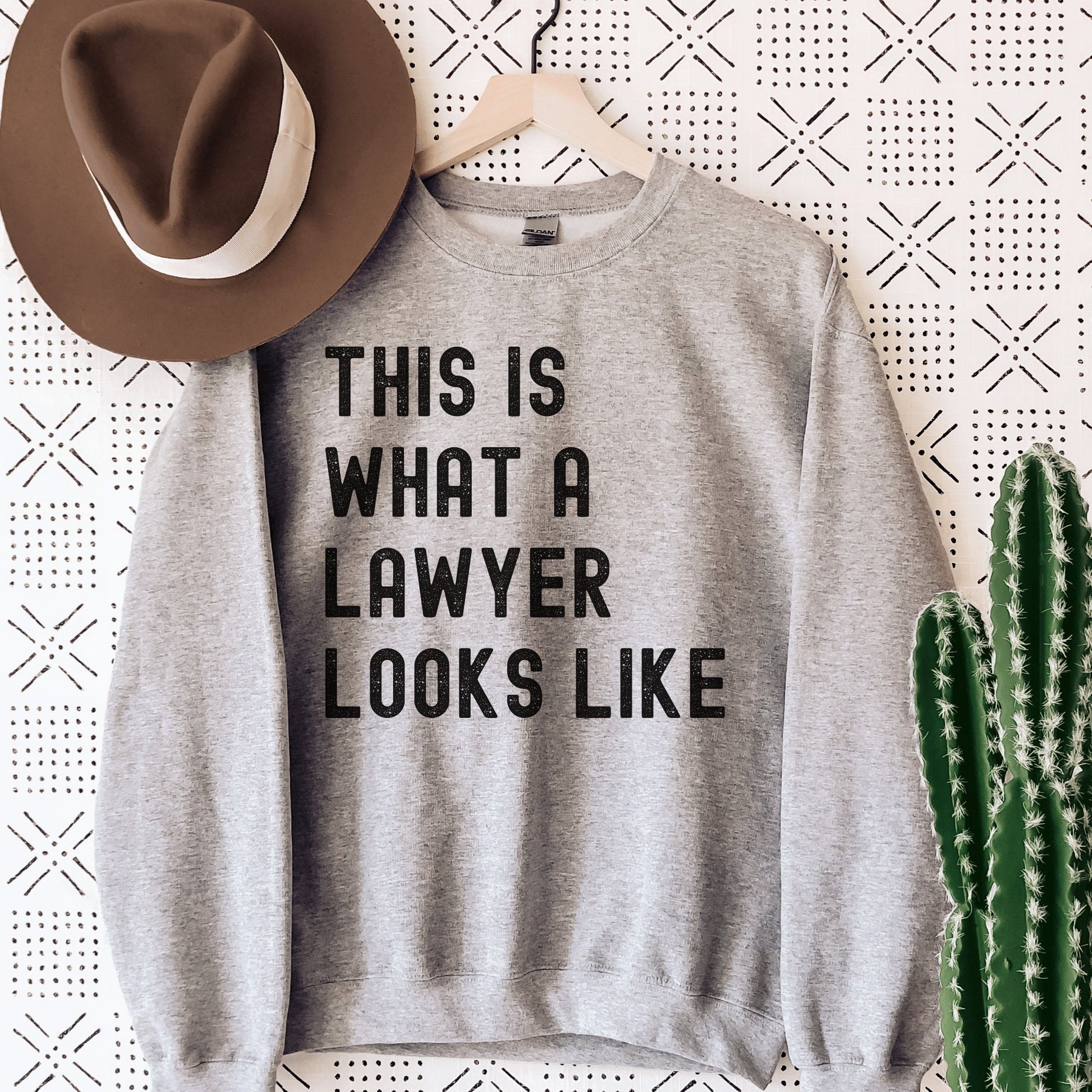 gray unisex lawyer sweatshirt that says this is what a lawyer looks like