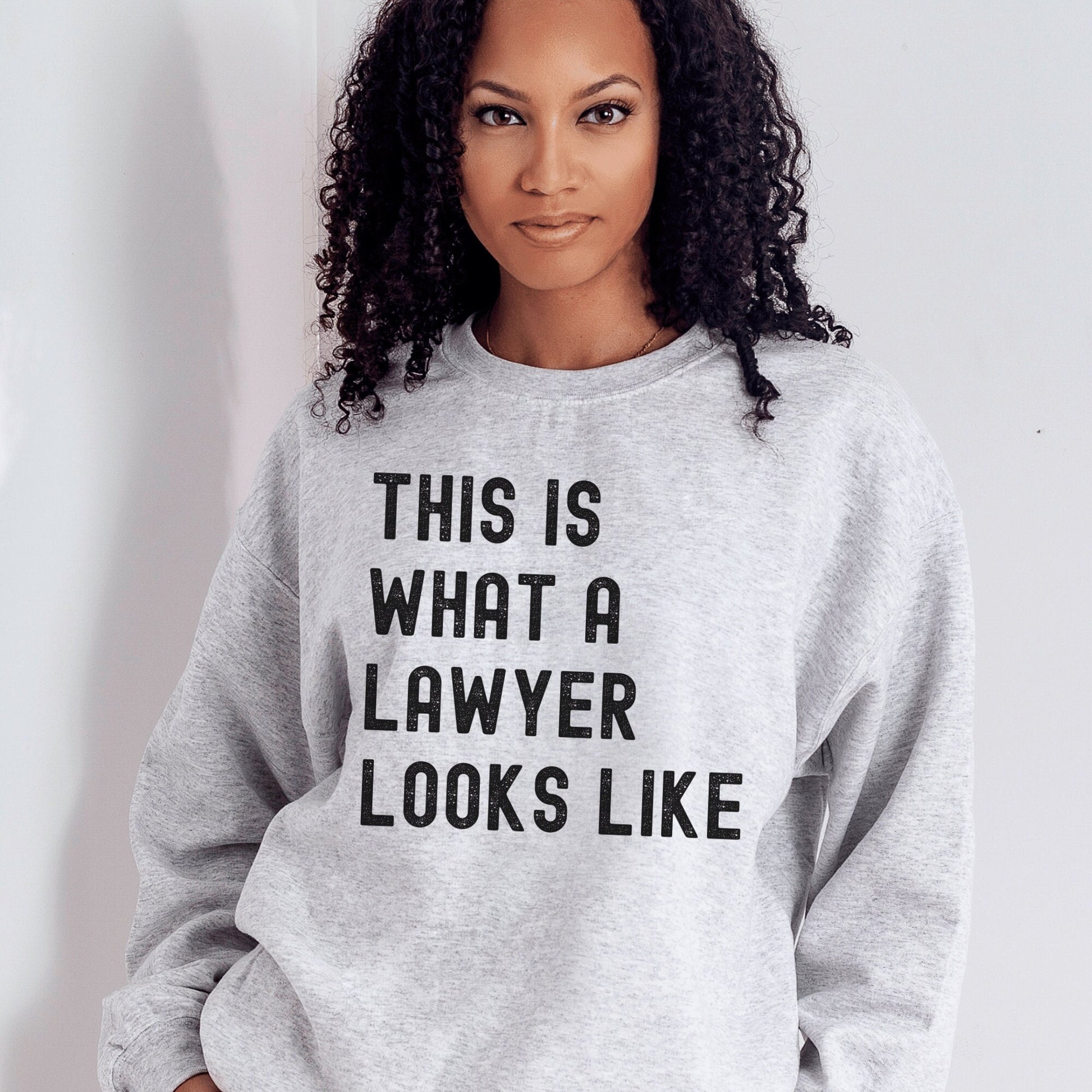 light gray unisex lawyer sweatshirt that says this is what a lawyer looks like