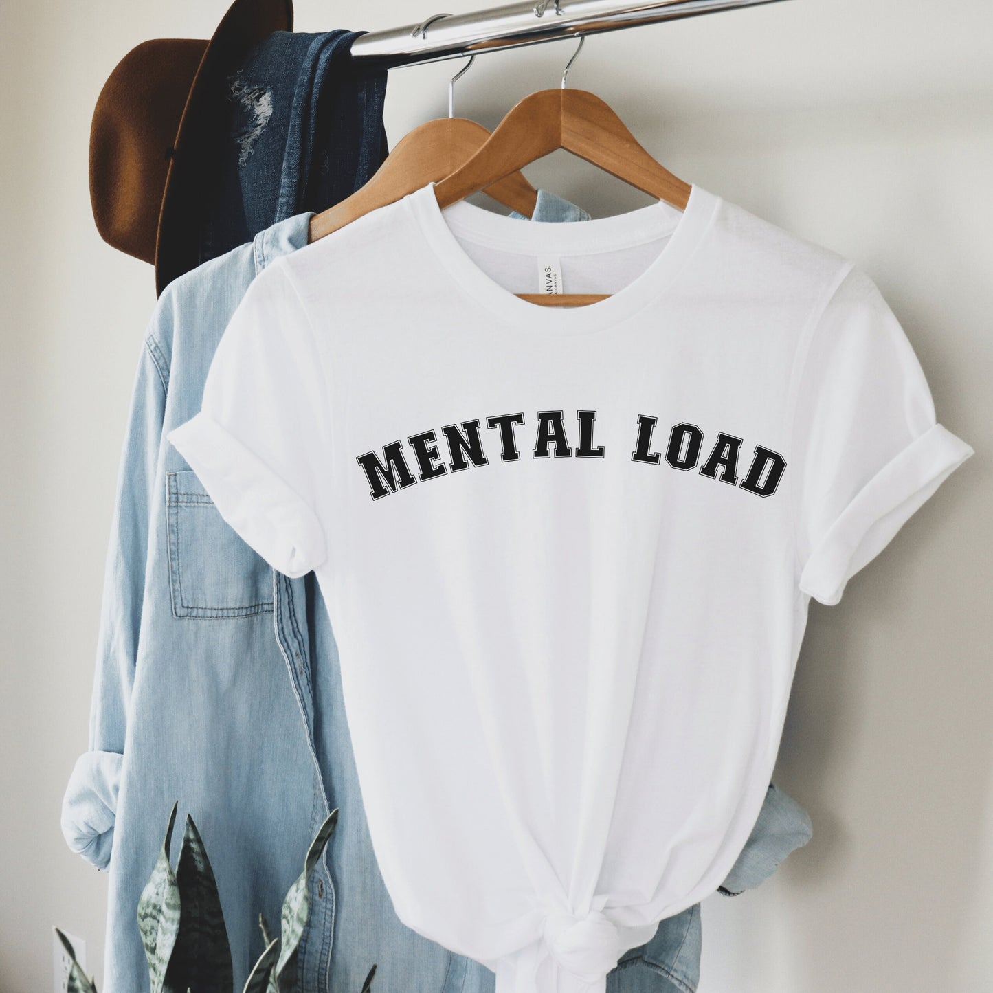 white unisex overstimulated mom shirt that says mental load