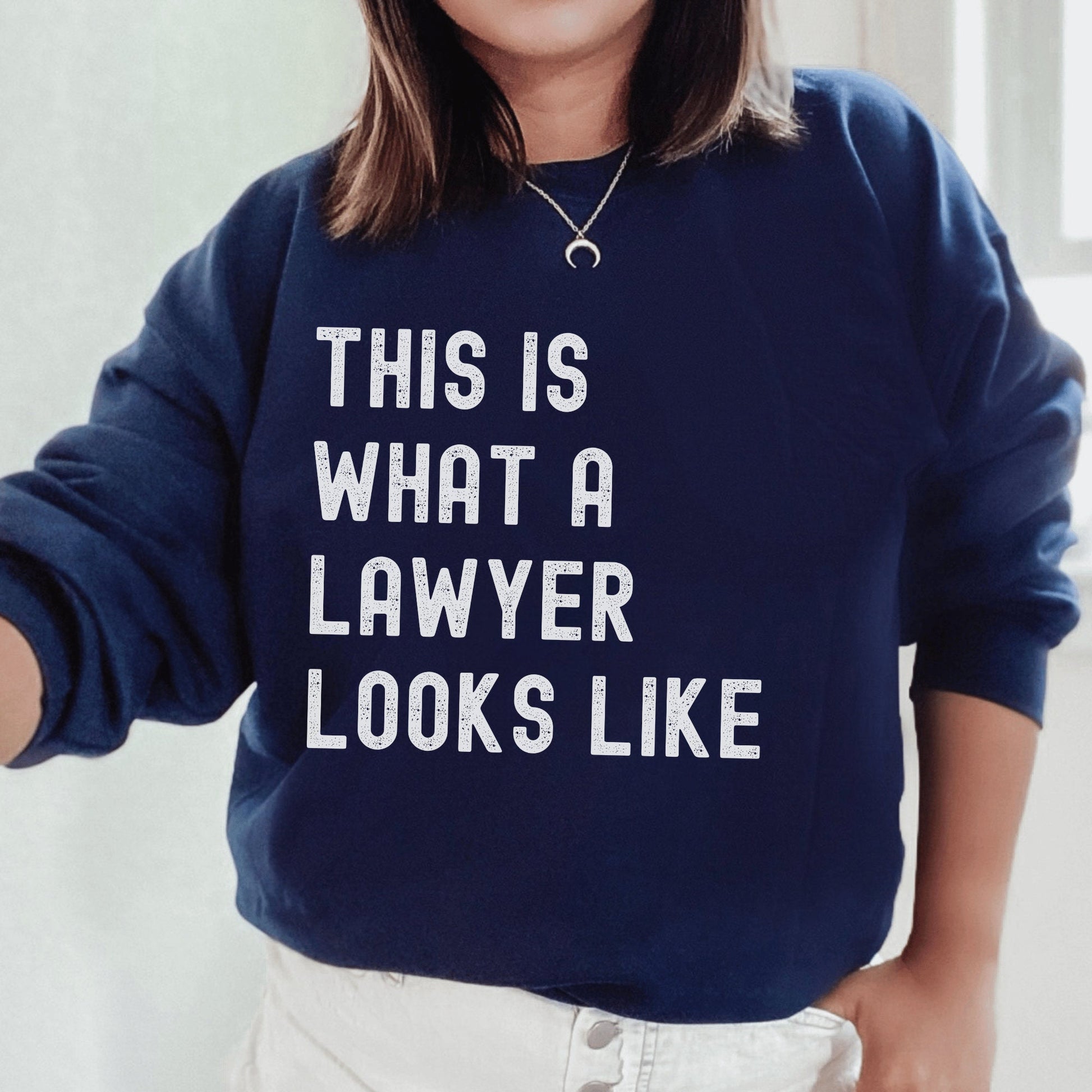 navy blue unisex lawyer sweatshirt that says this is what a lawyer looks like