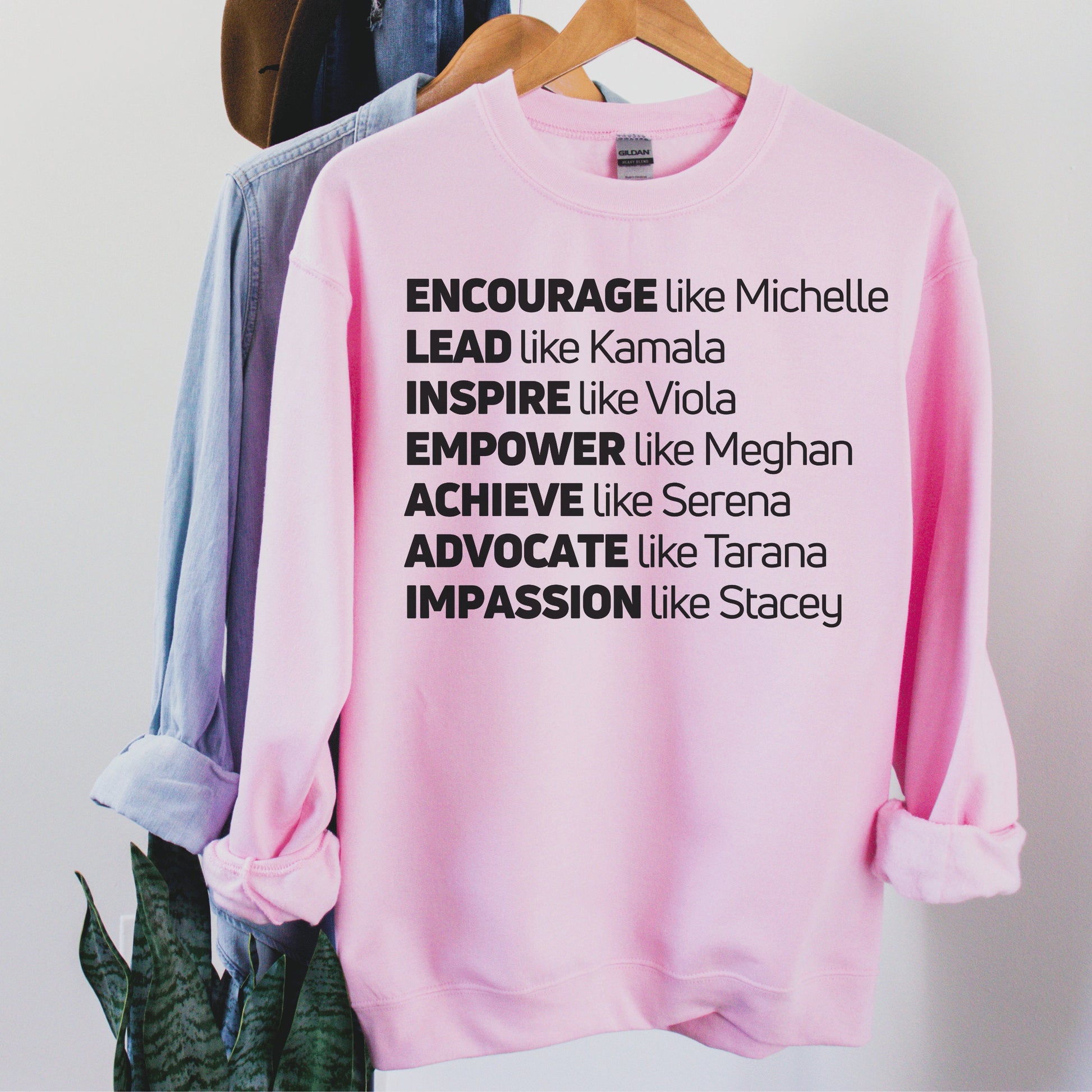 pink unisex melanin sweatshirt that says encourage like michelle, lead like kamala, inspire like viola, empower like meghan, achieve like serena, advocate like tarana, impassion like stacey