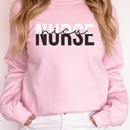 pink unisex nicu nurse sweatshirt with the word "nurse" in all capital letters with the top half colored in white and the bottom half covered in black, with the word nicu in cursive black letters within the word nurse