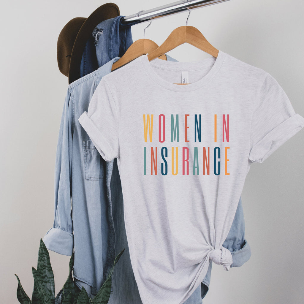 light gray unisex t-shirt that says "women in insurance" in all capital, multicolored letters, our t-shirts make great gifts for insurance agents