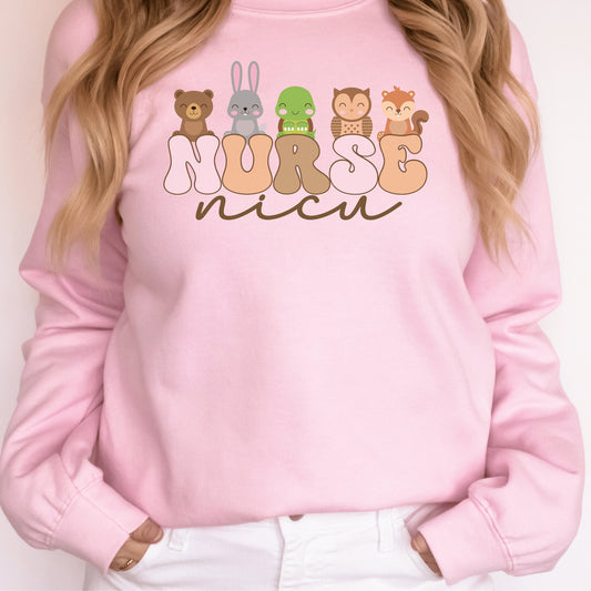 pink unisex nicu nurse sweatshirt with nurse in retro capital multicolored letters and the word nicu in brown script underneath. Baby animals are on top of the word nurse